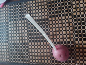 a straw in a potato